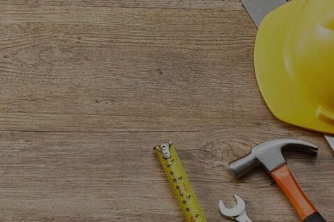 handy man tools on wooden surface