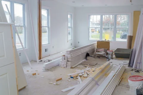 Handyman finishing drywall during a home remodel in Minneapolis